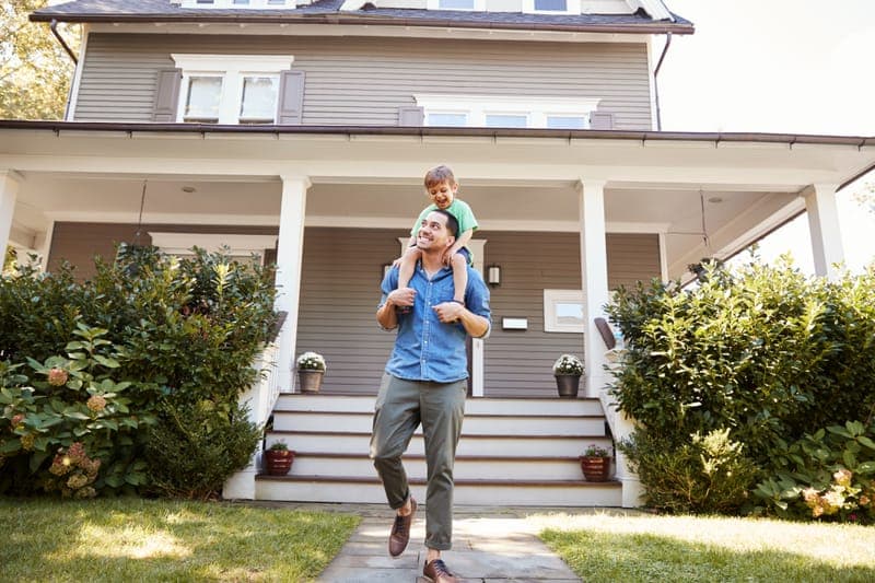Family in front of their home